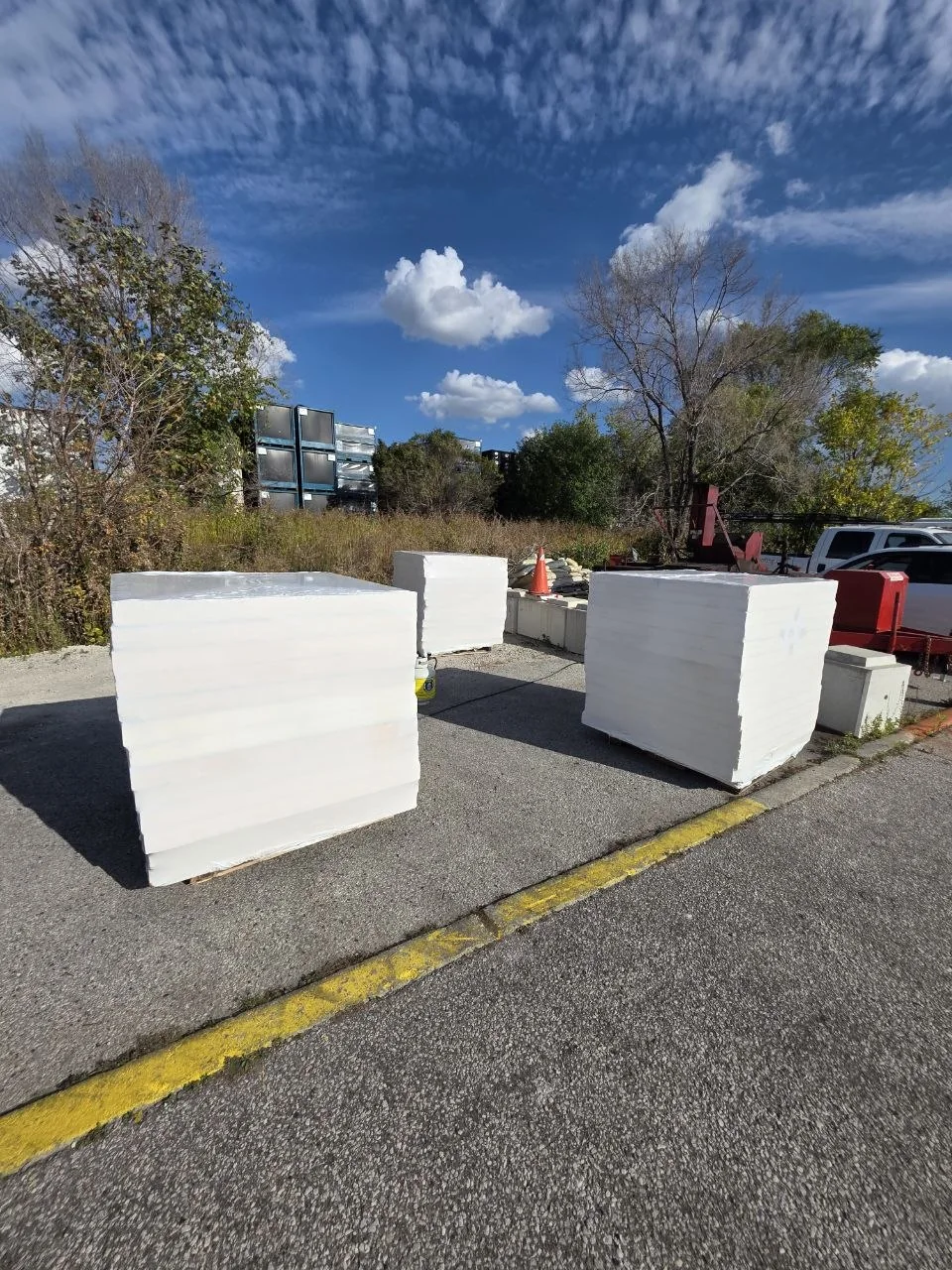 Pallets wrapped together with white shrink wrap