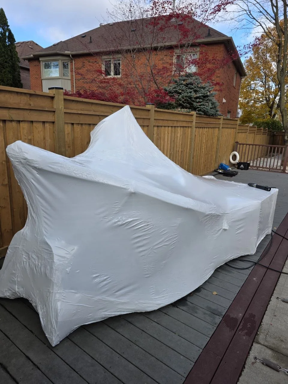 Custom outdoor project fitted with white shrink wrap
