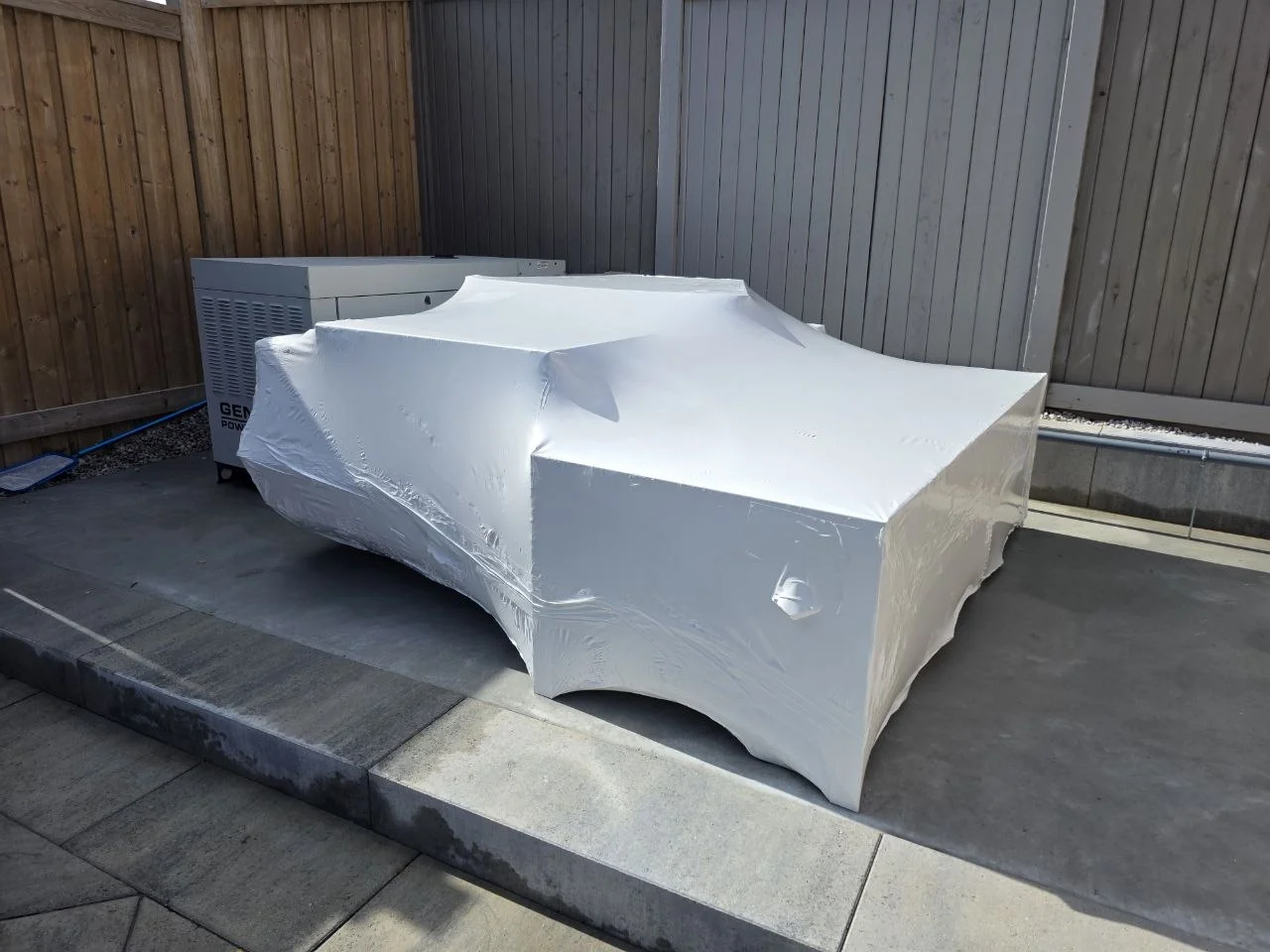 Angular outdoor equipment protected with fitted shrink wrap