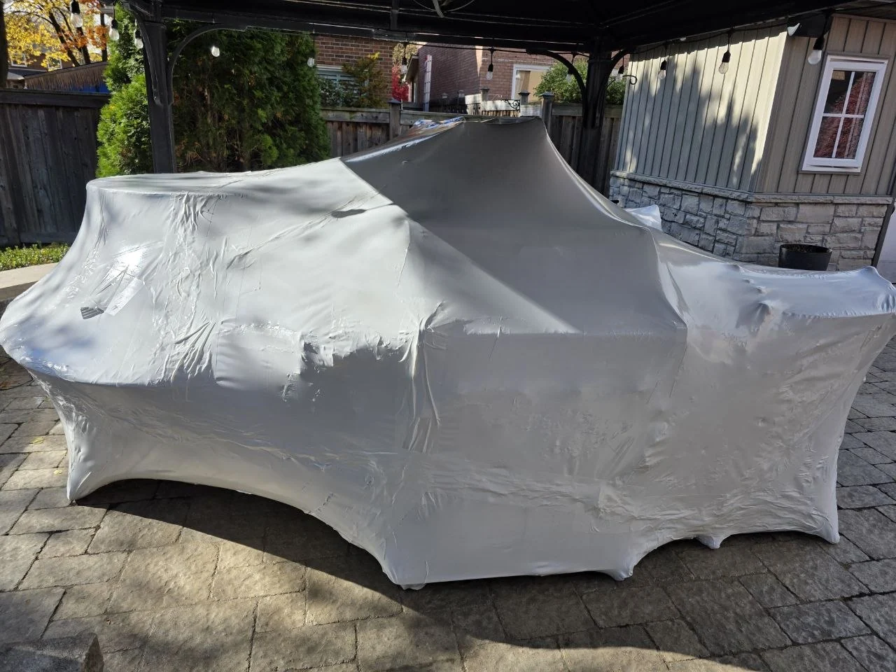 Unusually shaped furniture protected with fitted shrink wrap