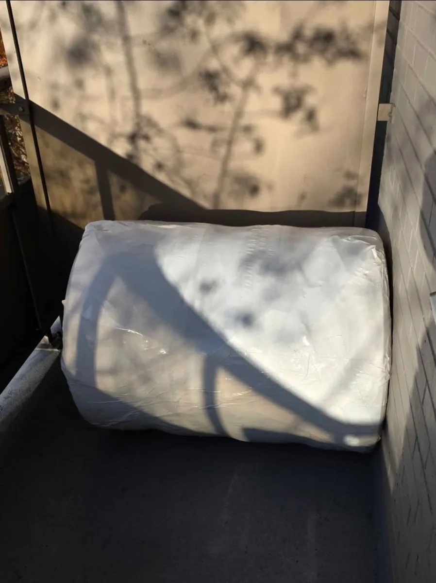 Tires and rims wrapped together for balcony storage